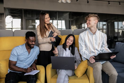 A diverse group of young professionals collaborating in a modern office setting.