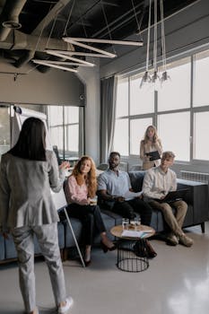 A team of professionals engaged in a business meeting in a modern office setting.