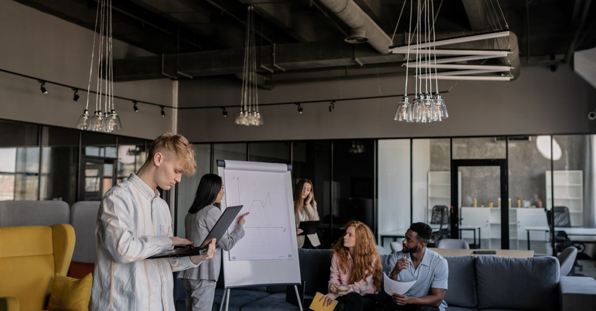 startup team meeting in open plan office