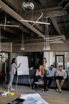 Colleagues brainstorm during a business meeting in a stylish office space.