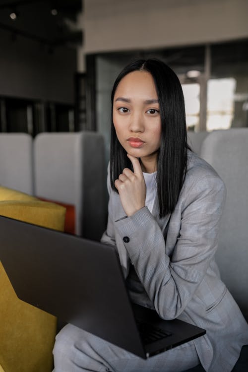 Portrait of a Woman with a Black Laptop