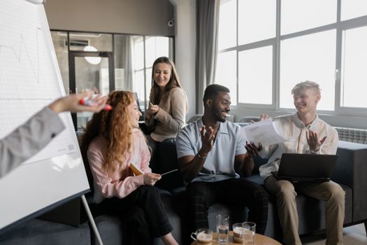 Diverse group of colleagues collaborating in a bright and modern office environment.