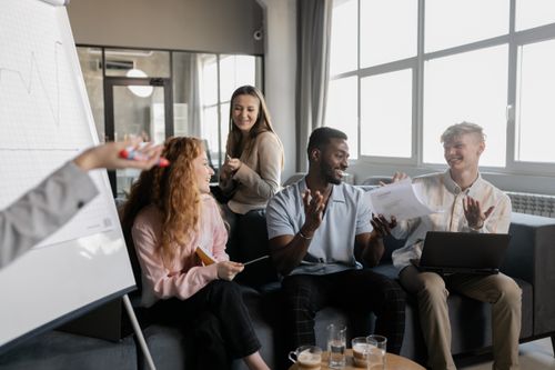 Free Diverse group of colleagues collaborating in a bright and modern office environment. Stock Photo