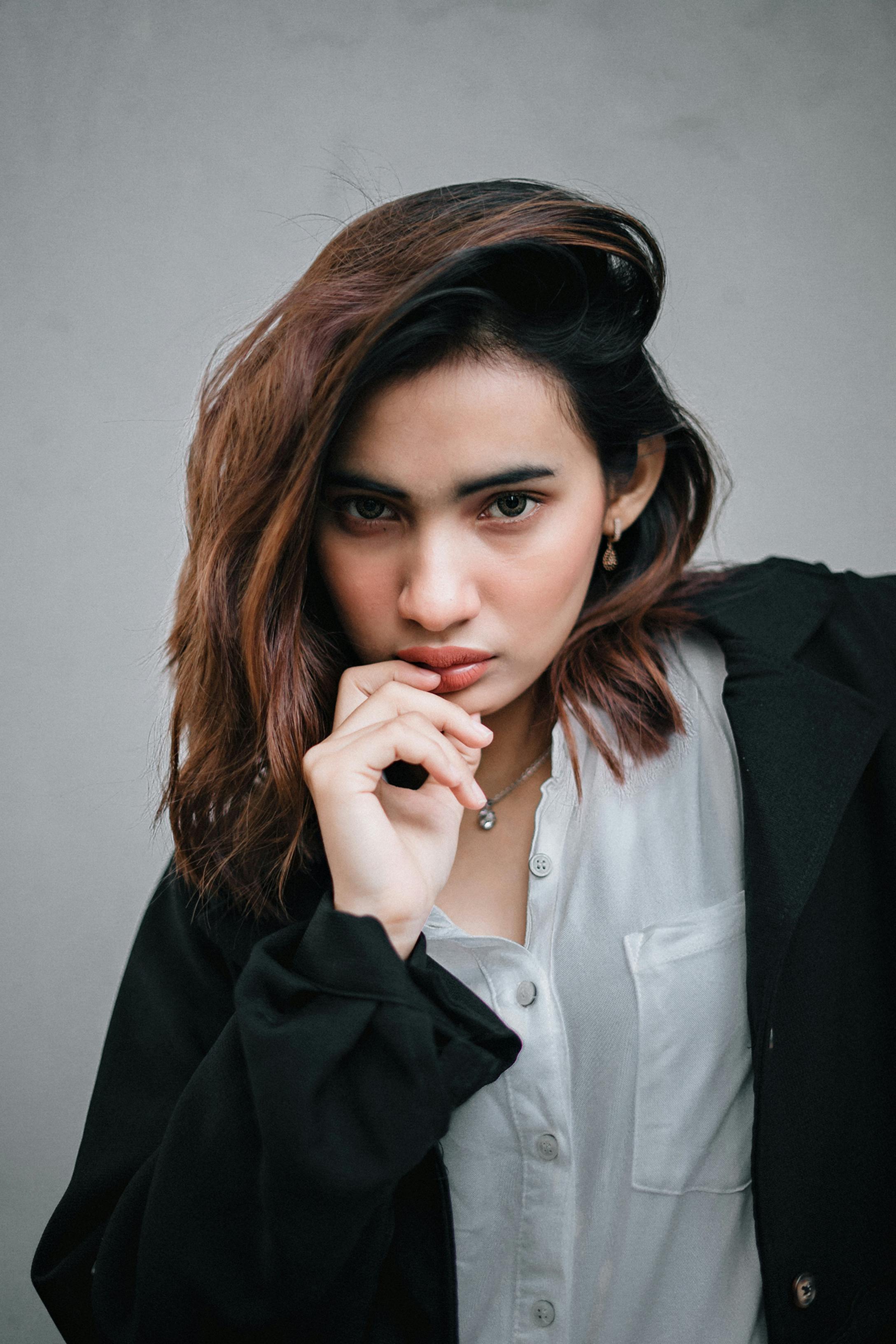 Close-up of a Get Movers packer wrapping a delicate wine glass in high-quality packing paper for a King City condo move.