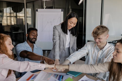 A Group of People Having a Meeting in the Office