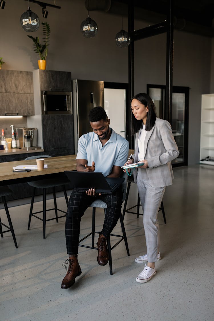 A Man And A Woman In An Office