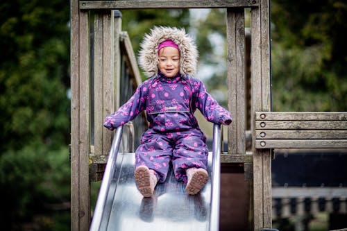 Free A Girl in Purple Jacket Sliding Stock Photo
