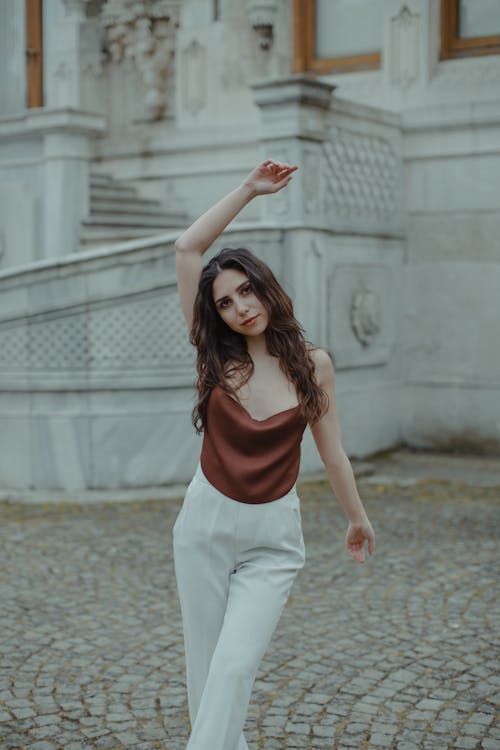 Woman Posing with Arm Raised