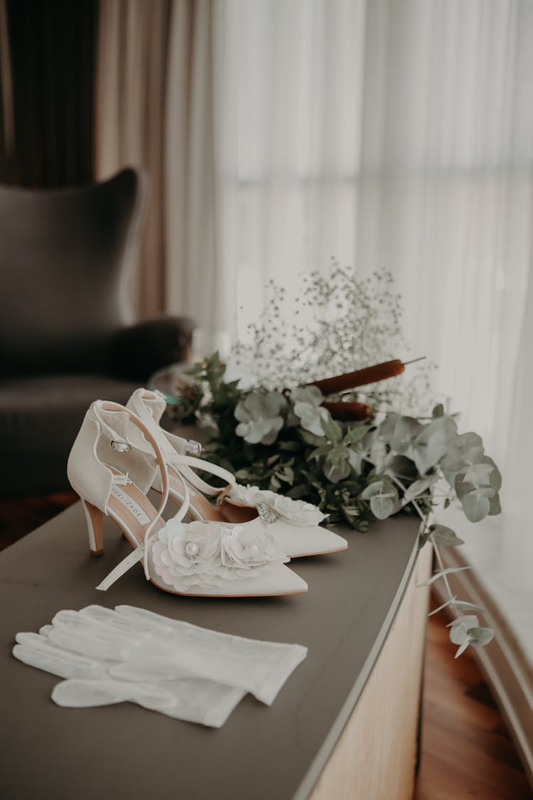 Close Up Of Wedding Shoes And Gloves