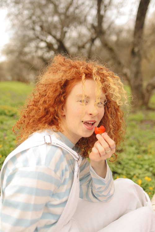 Woman Eats Strawberry