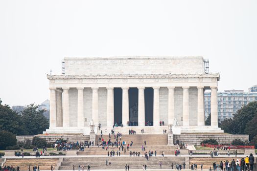 The iconic Lincoln Memorial surrounded by tourists on a day visit in Washington, DC.