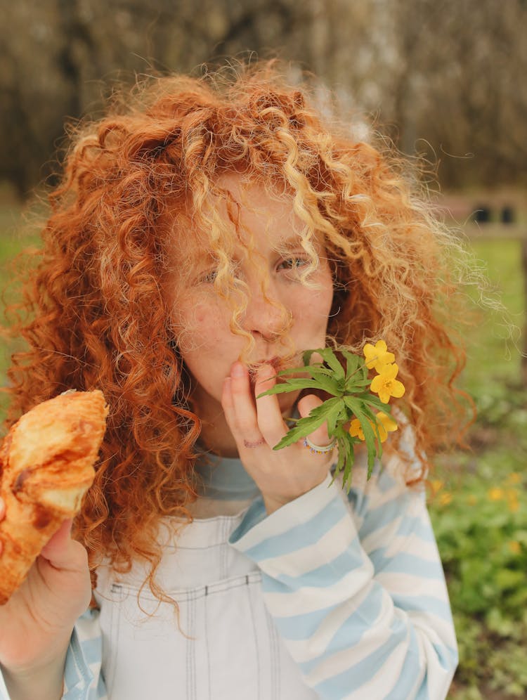 Woman Holding Yellow Flower And Bread