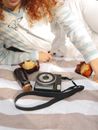 Black and Silver Dslr Camera on White Textile