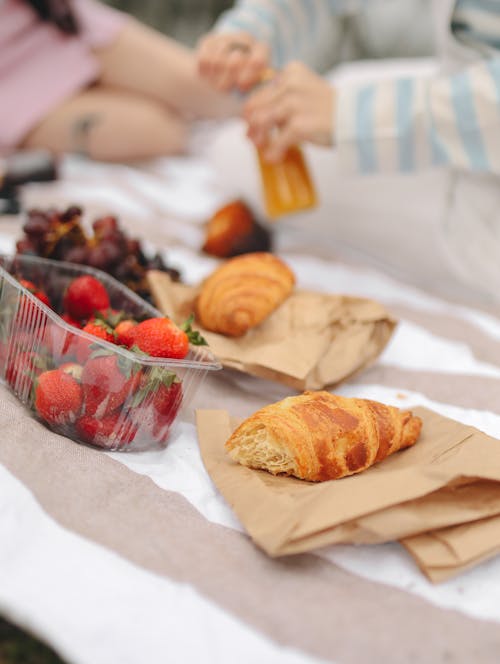 Free Fruits and Croissants on a Picnic Blanket Stock Photo