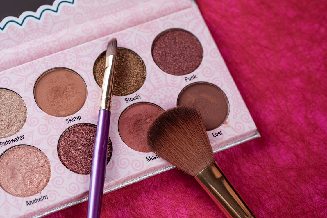 Make-up Brushes Beside the Eyeshadow Palette
