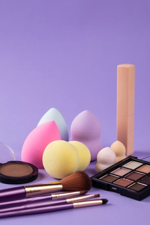 Makeup Products on Purple Surface