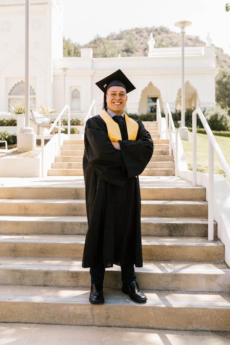 A Man Wearing A Graduation Robe