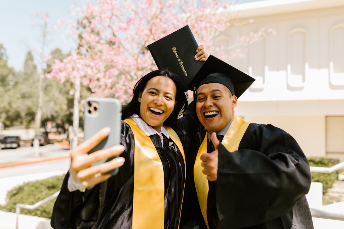 Woman Holding Diploma Taking Selfie with a Man · Free Stock Photo