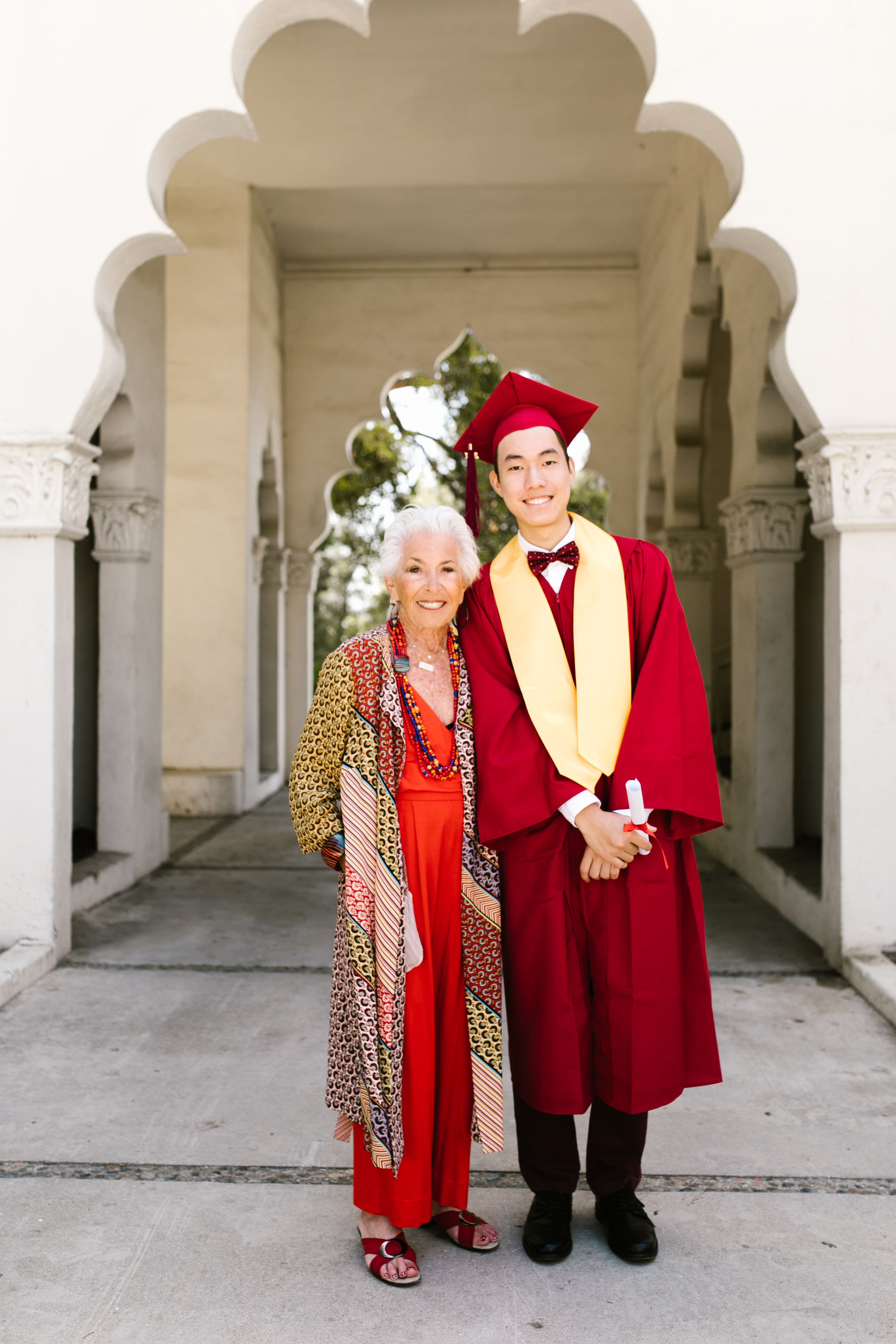 A Man in an Academic Dress with His Grandmother  Free Stock Photo
