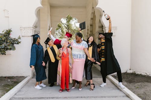 Proud Grandmothers Surrounded by Graduating Students