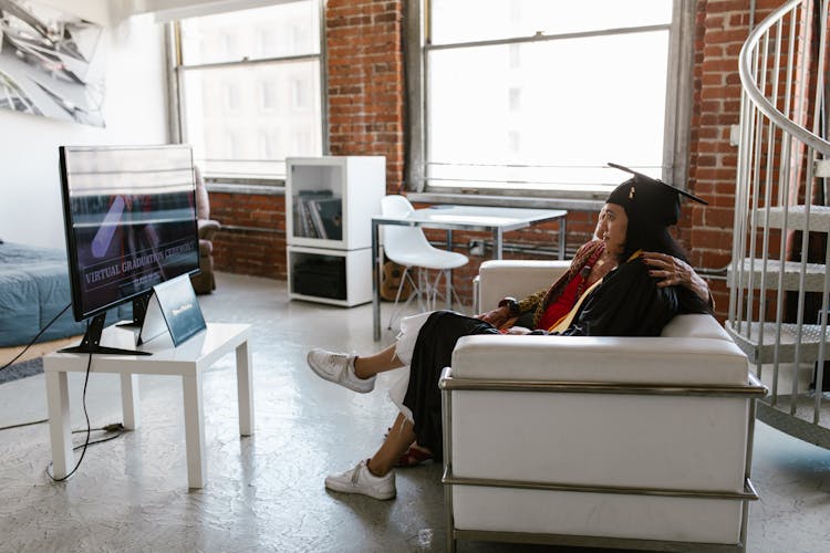 Graduate Watching Virtual Graduation