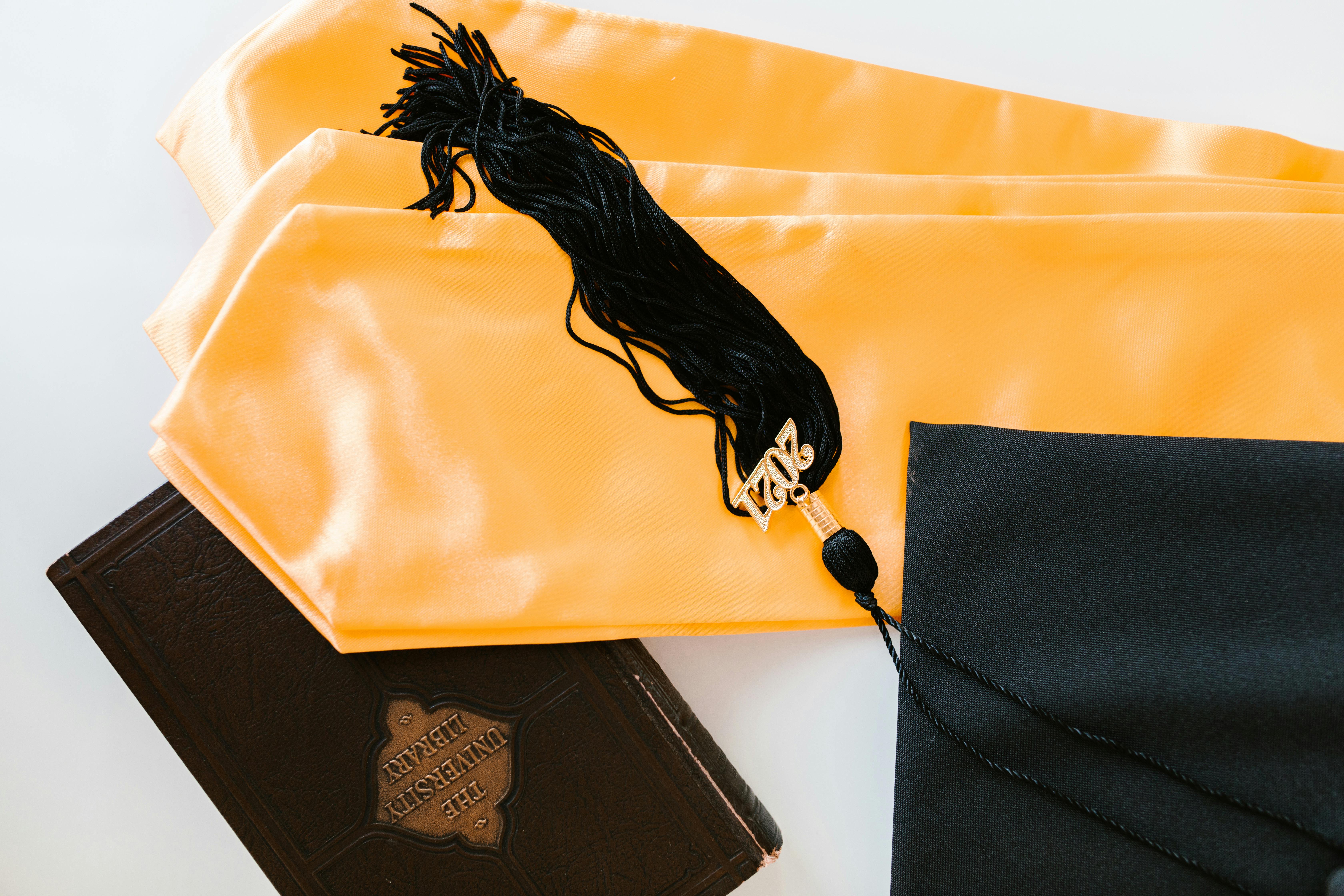 graduation cap and scarf on white background