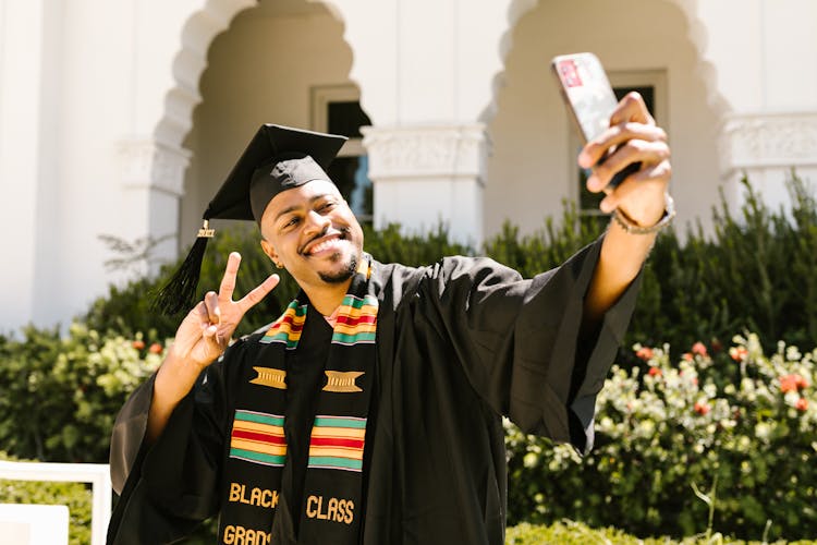 Man Taking Graduation Selfie