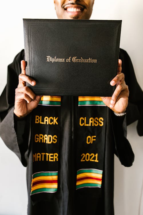 Person Holding His Diploma 