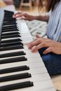 Person Playing Piano on Blue Textile