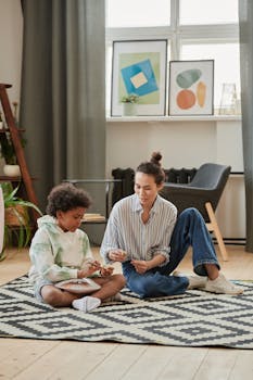 A child is learning in a creative setting with a mentor, engaging in a fun activity indoors.