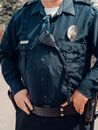 Man in Blue Button Up Jacket Wearing Black Leather Strap Watch