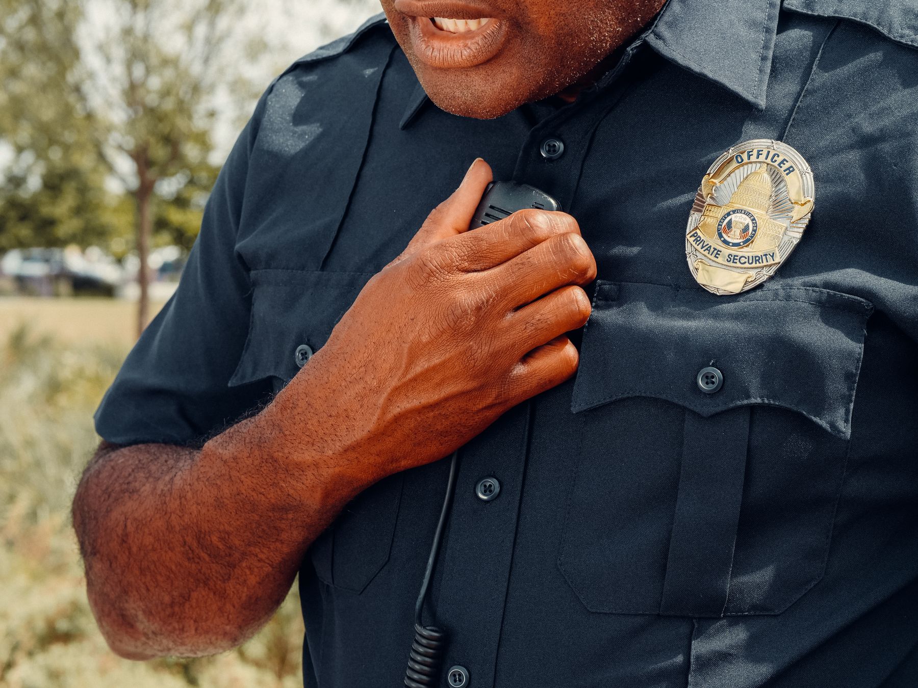 Security officer using a radio on patrol