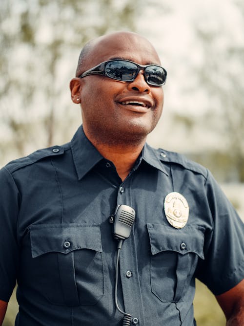 Free A Policeman in Black Sunglasses and Black Uniform Stock Photo