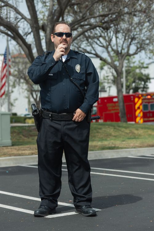 A Police Officer Wearing His Blue Uniform · Free Stock Photo