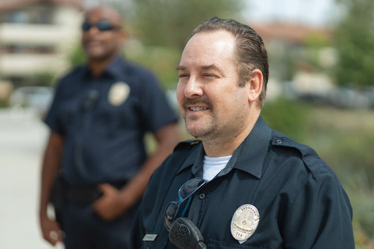 Close-Up Shot Of A Man Wearing Police Uniform