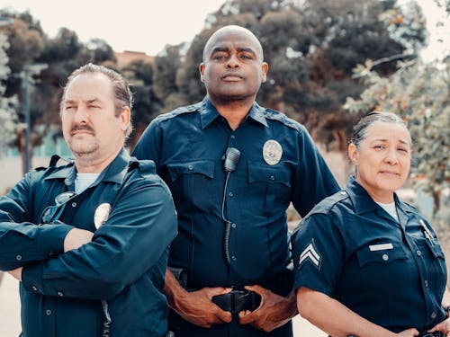 Free Three Police Officers in Blue Uniform Stock Photo
