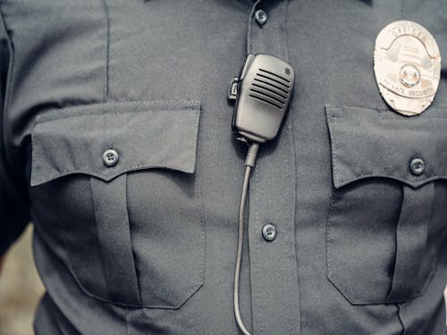 Free Person in Police Uniform with Body Cam Stock Photo