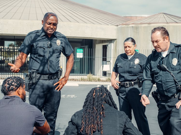 Two Police Officers Talking To A Men