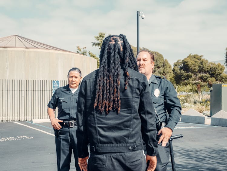 Two Police Officers Talking To A Man