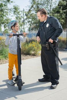 Man in Black Uniform Holding Black Metal Rod