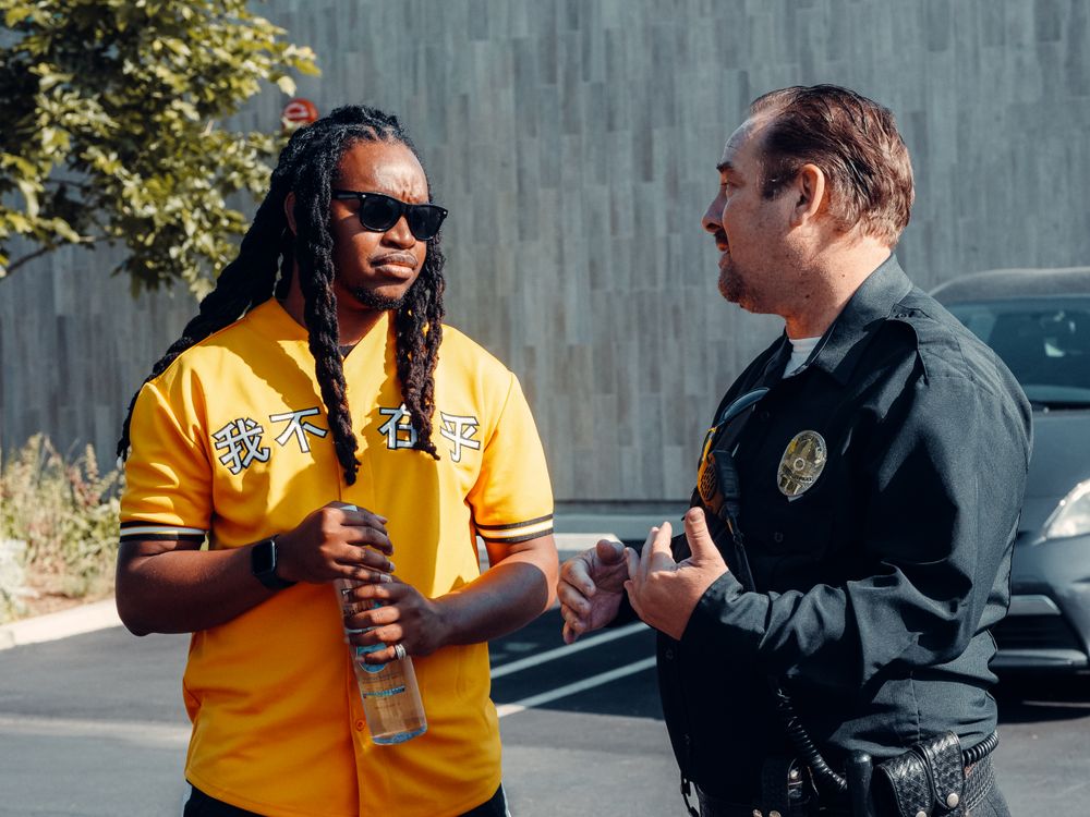 A security officer chatting with a man