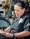 Man in Black Police Uniform Holding Smartphone