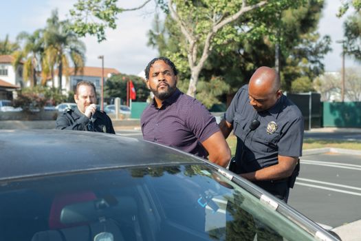 A Police Arresting a Man
