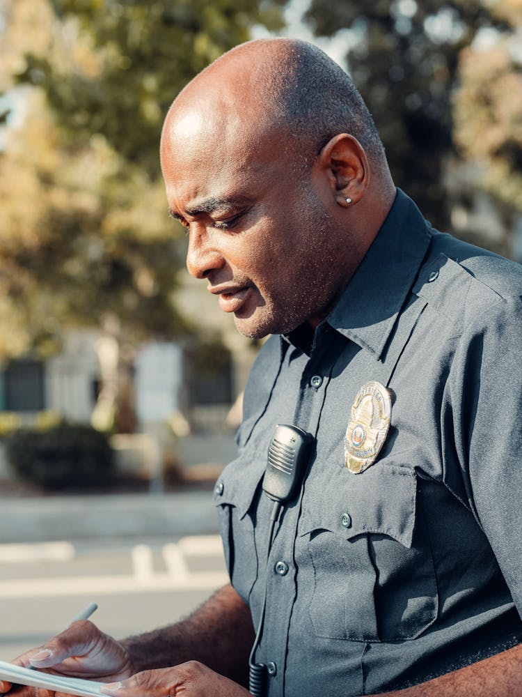 Bald Man In His Police Uniform 