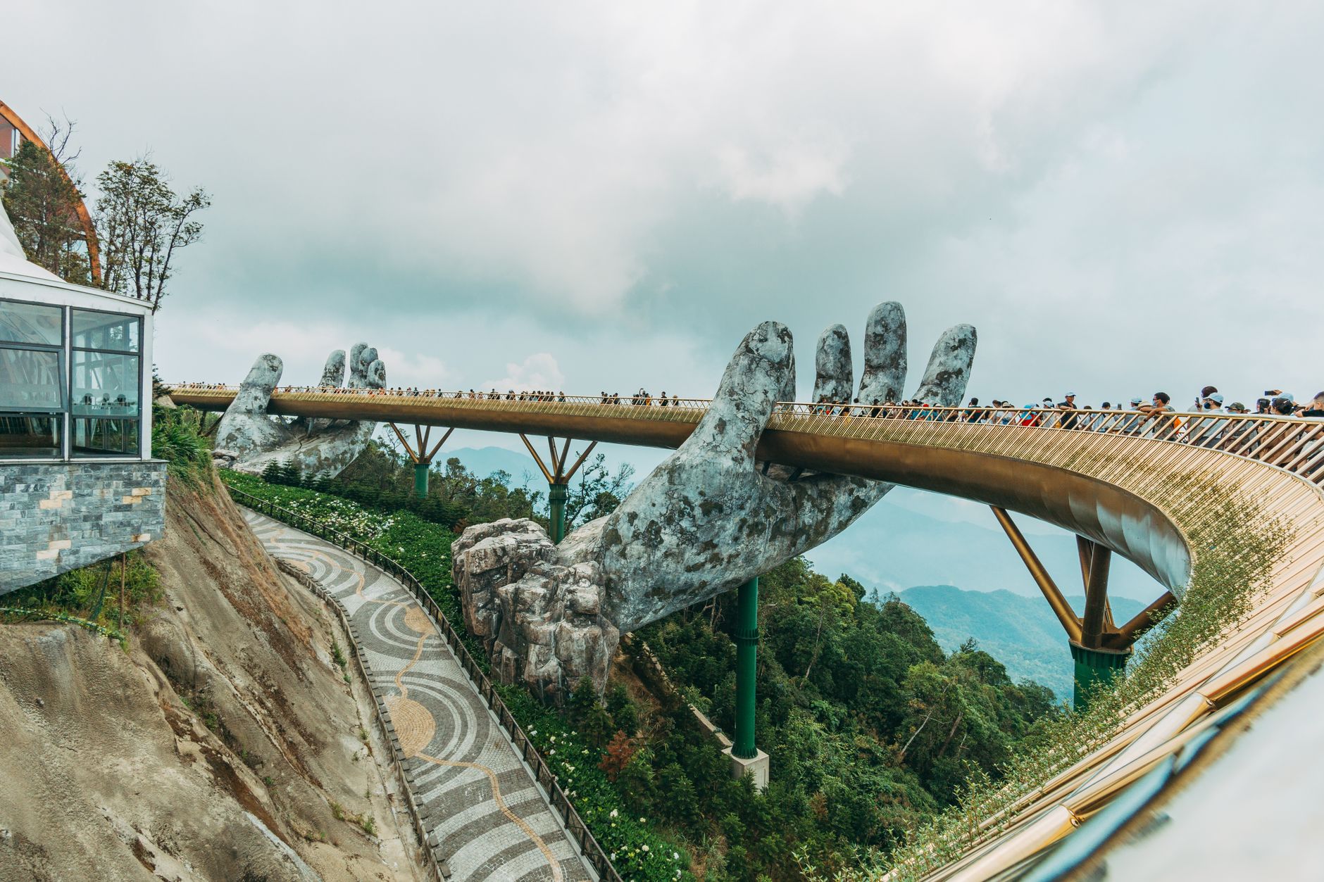 Iconic Golden Bridge with giant hands in Ba Na Hills, a tourist attraction in Vietnam.
