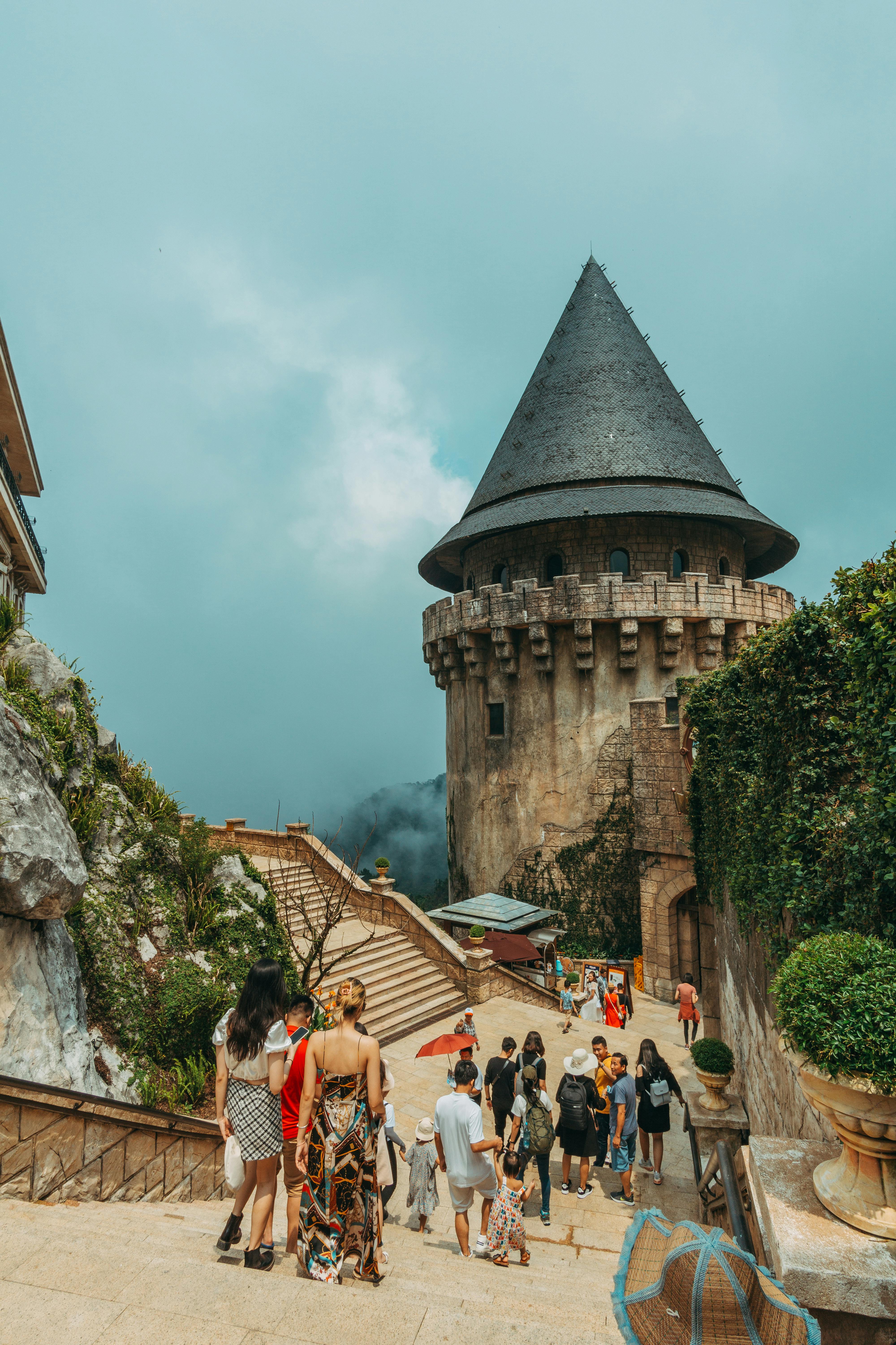 people walking in ancient castle