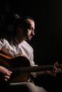 Man in White Dress Shirt Playing Guitar