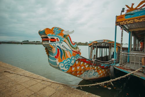 Colorful Boat Docked on Riverside