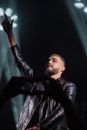 Man in Black Leather Jacket Holding Microphone