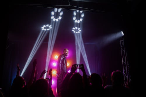 Audience Taking Photos Using Smartphones 